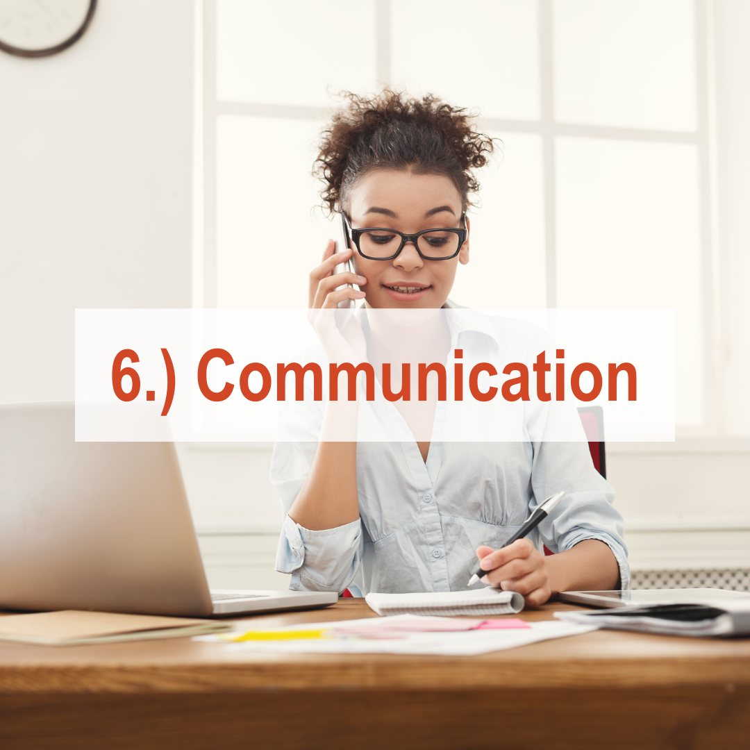 Woman sitting at desk talking on phone and looking at computer | Communication