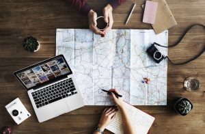 picture of two people drawing on a map