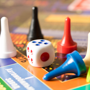 A board game with white, black, red, and blue pieces.