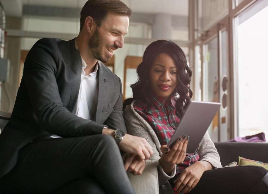 2 people viewing tablet