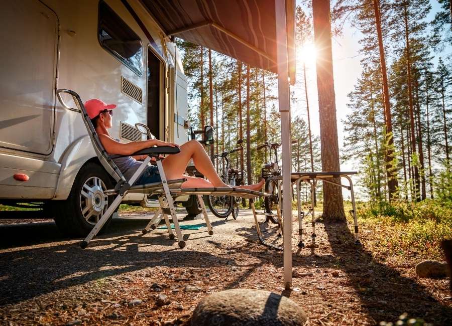 Woman relaxing outside RV