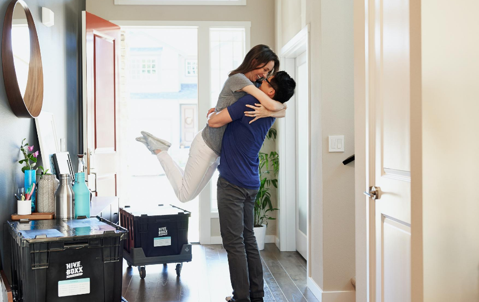 Couple Embracing in New Home