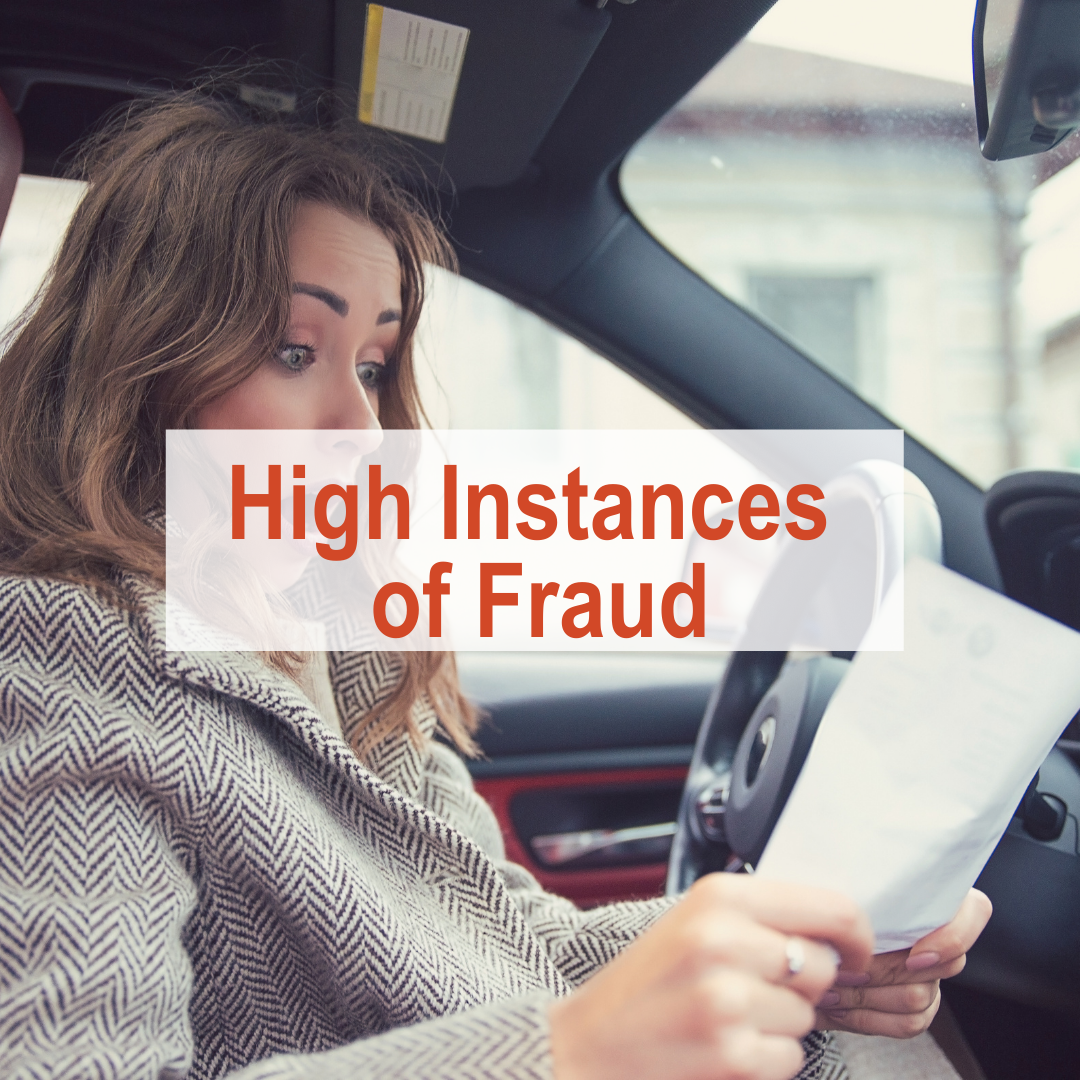 Woman in car with surprised face looking at paper | High Instances of Fraud