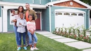 Family in front of their home