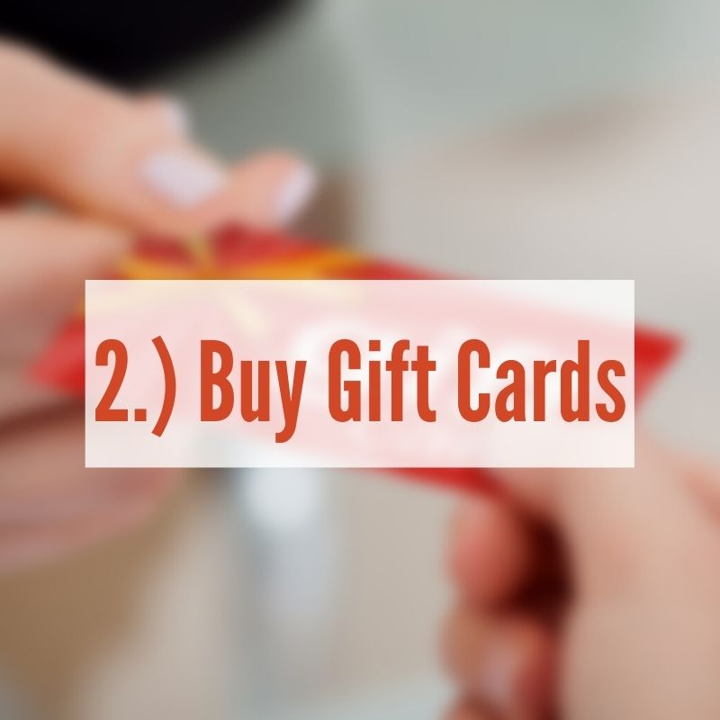 Someone handing a gift card over | Gift Card