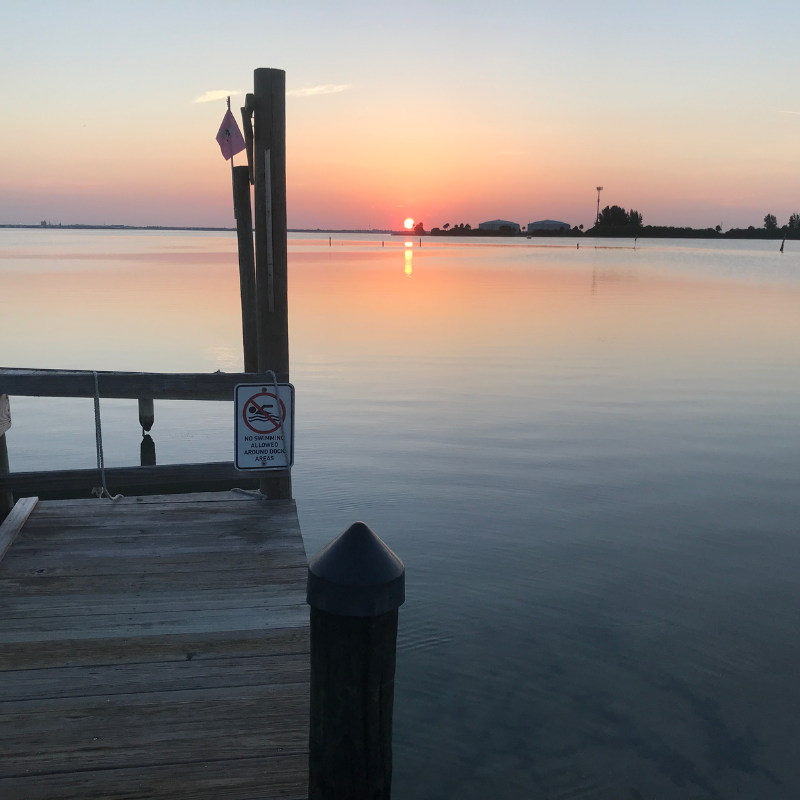 A sunrise from a dock