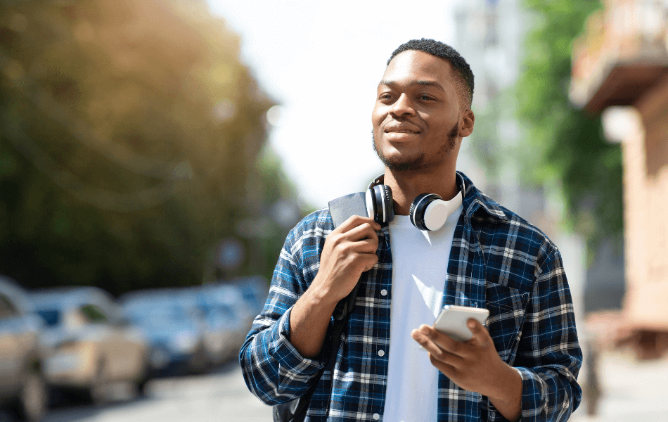 Man smiling with a phone in his hand