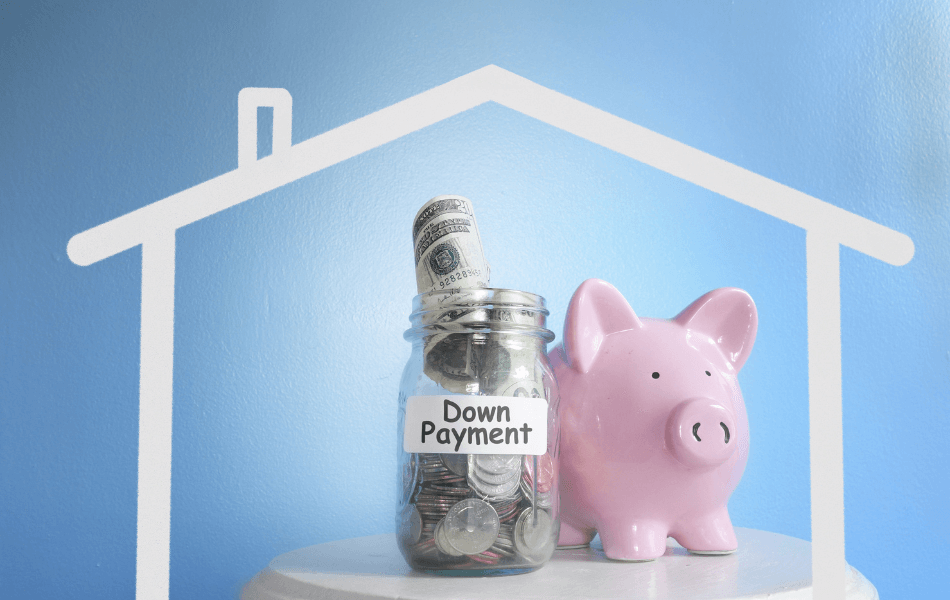 Piggy bank next to a jar full of money that is labeled "down payment"