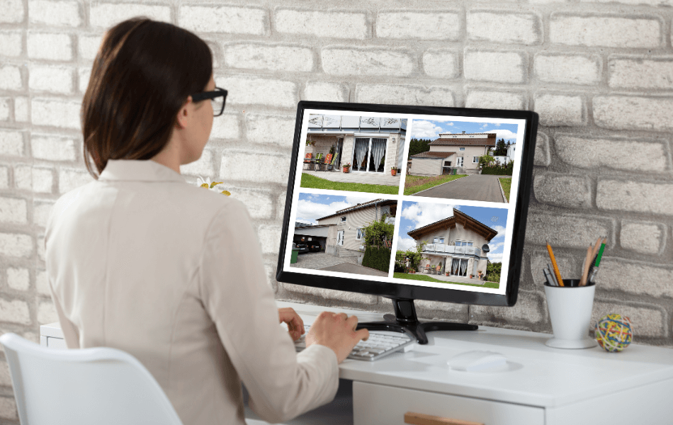 Person viewing homes on a computer