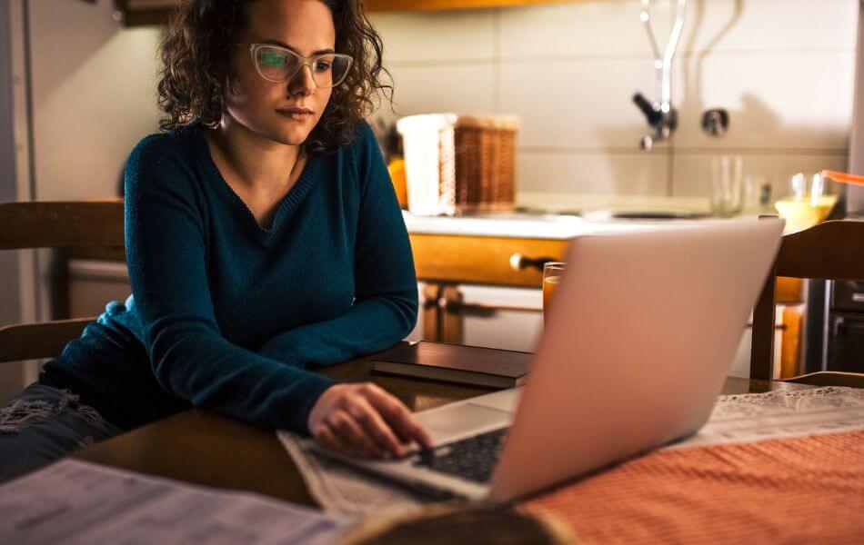 Woman on computer, paying a bill