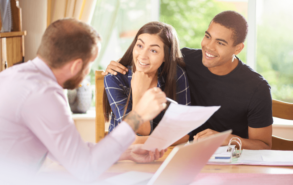 Couple sitting with mortgage lender