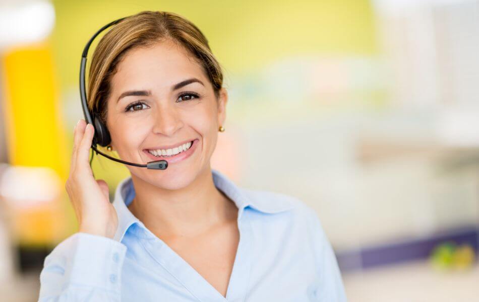 Woman working in customer service call center, wearing a headset