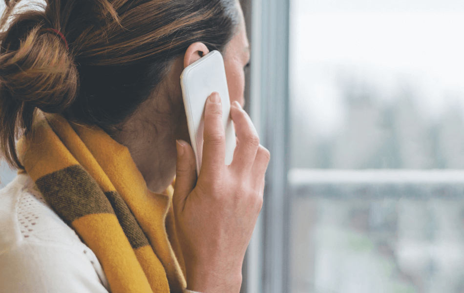 Woman with phone up to her ear