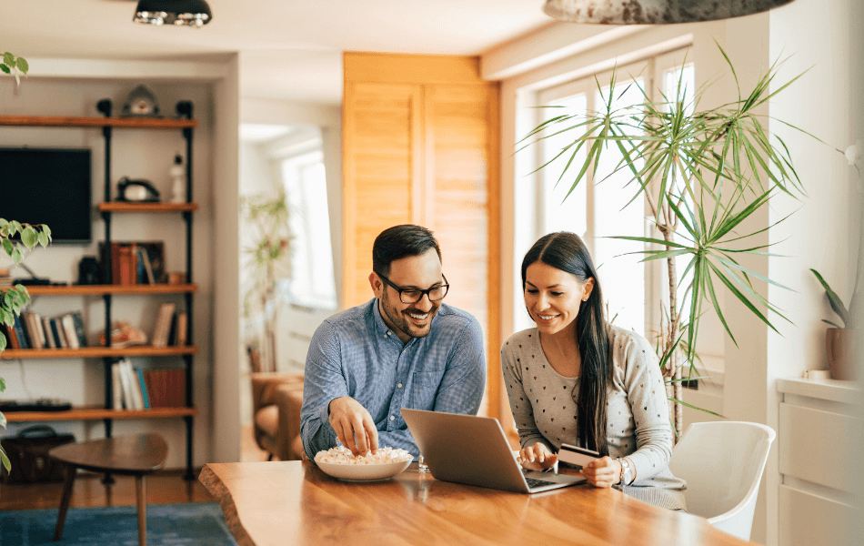 Couple looking at laptop together