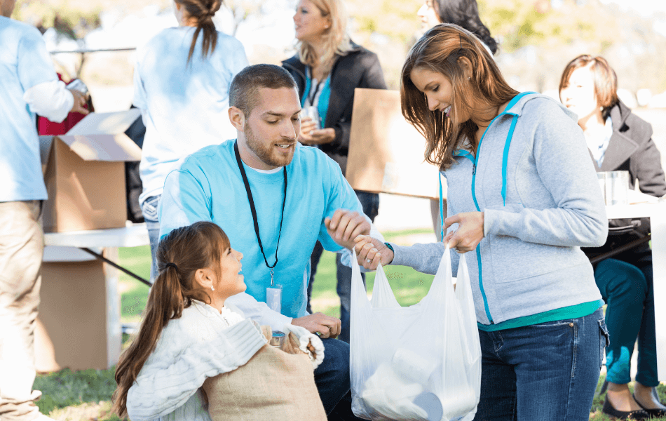 volunteers handing out disaster relief packages