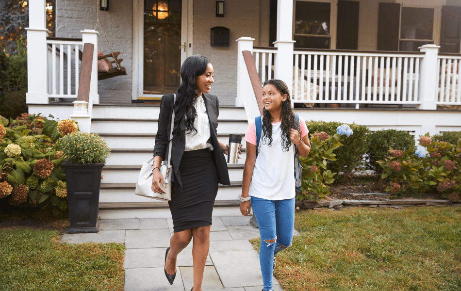 Mother and daughter walking away from the house