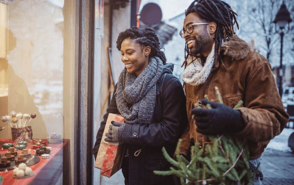 woman and man holiday shopping together