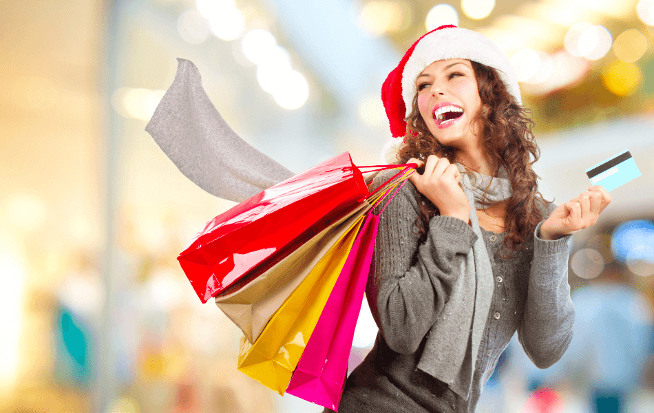 lady holding shopping bags and a credit card