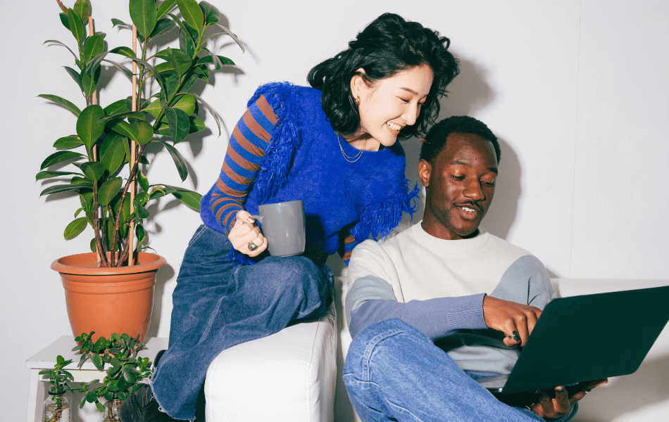 Couple looking at a laptop together