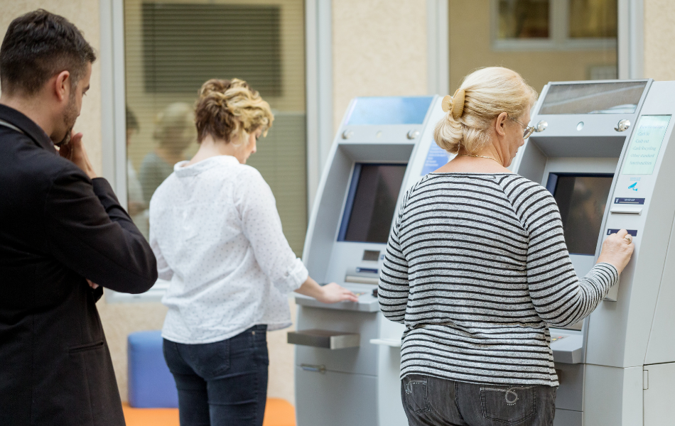 Scammer watching an ATM transaction