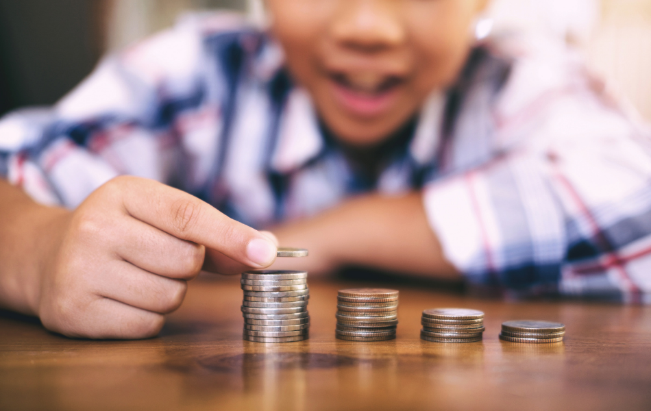 Kid stacking coins