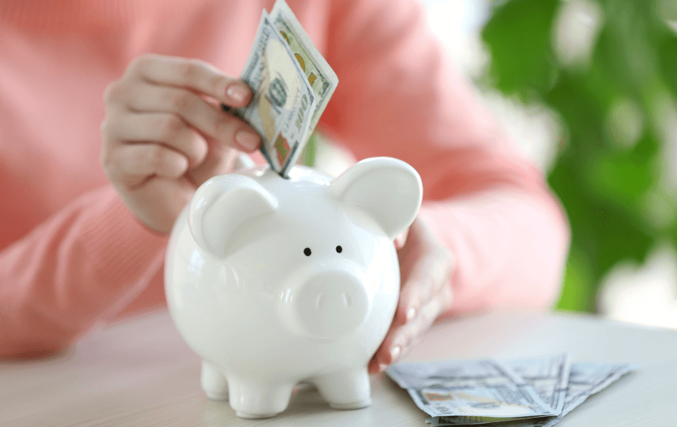 Putting cash in a piggy bank