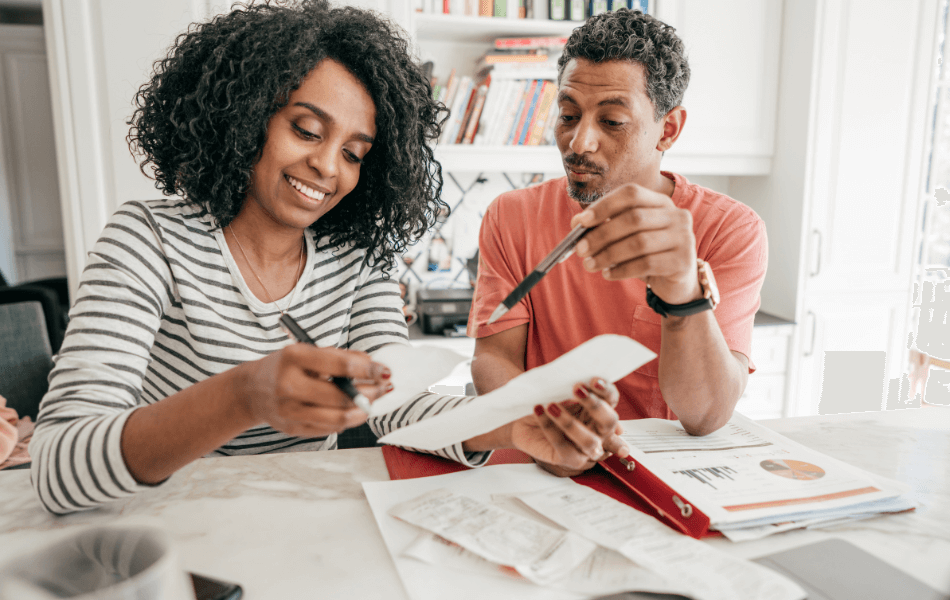 Couple looking at their receipts for tax filing