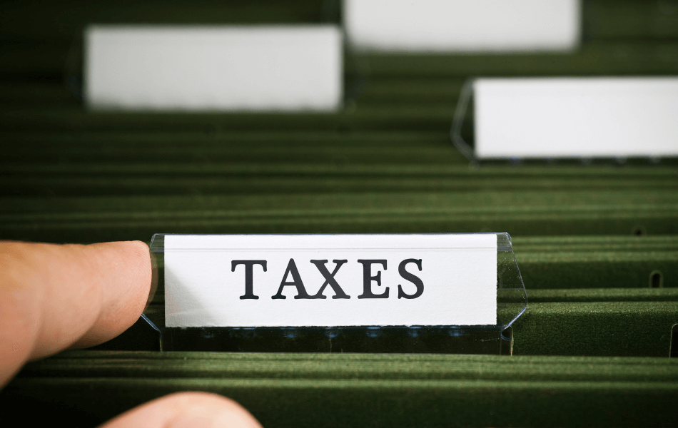 "Taxes" folder in a filing cabinet