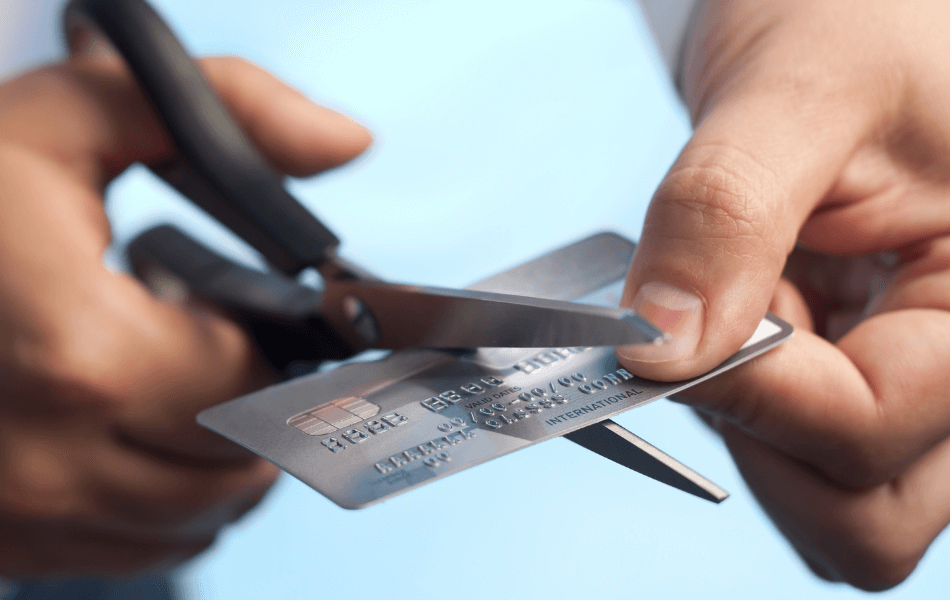 Cutting a credit card with scissors