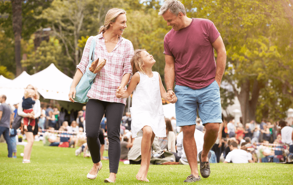 Family of 3 at an outdoor event