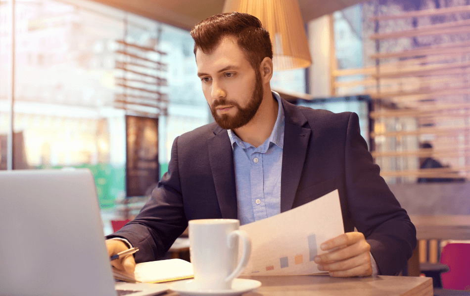 Person working on laptop in cafe