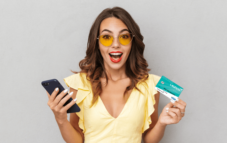 Person holding a Platinum Visa Rewards Credit Card