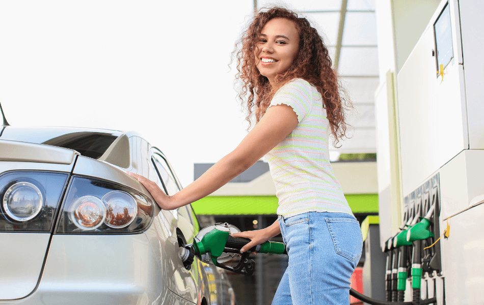 person filling up gas tank