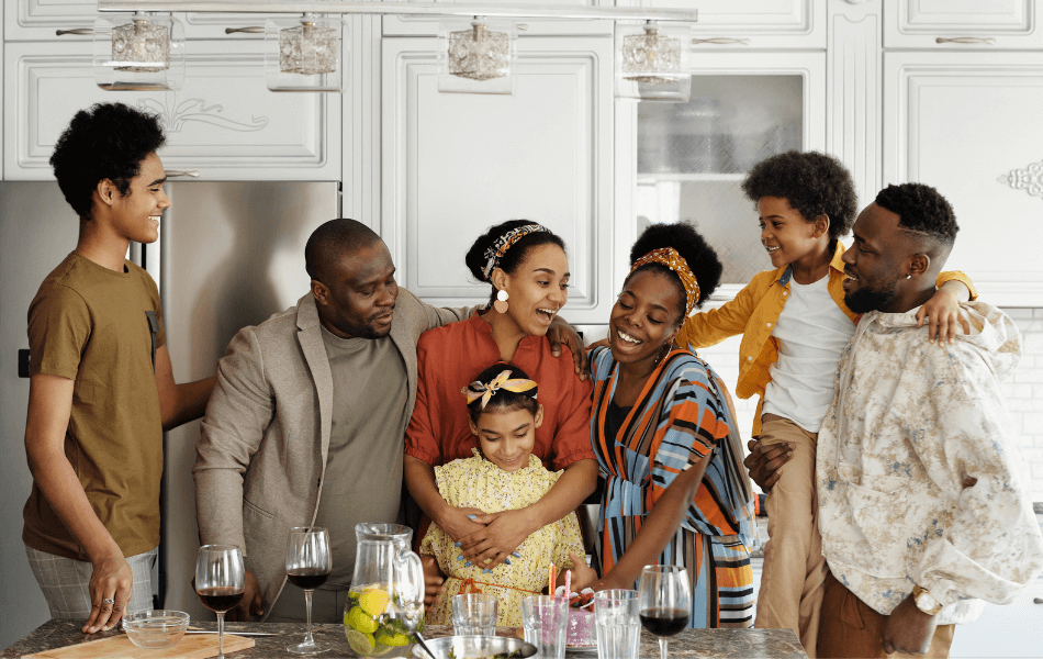 Family of 7 gathered around the kitchen