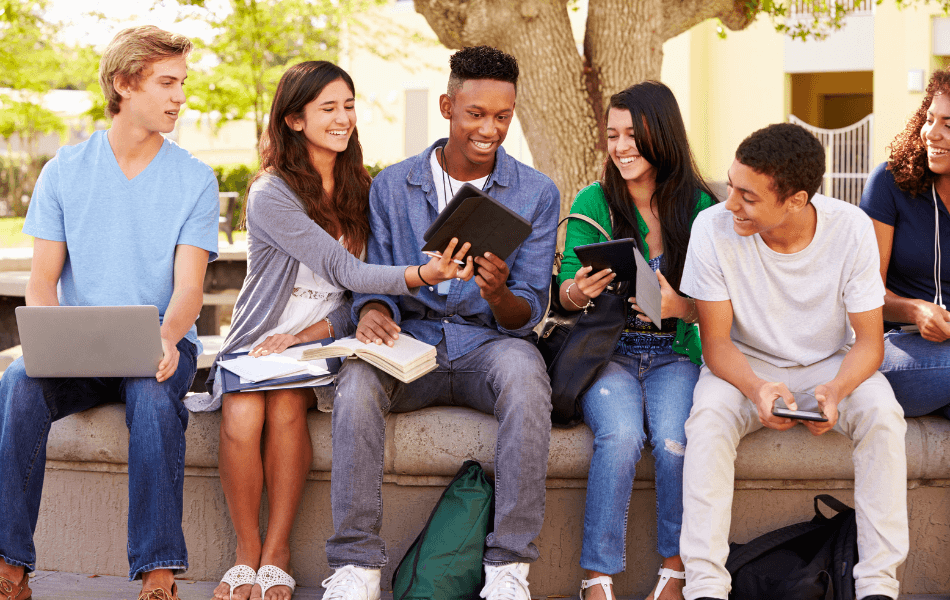 High school students looking at a tablet