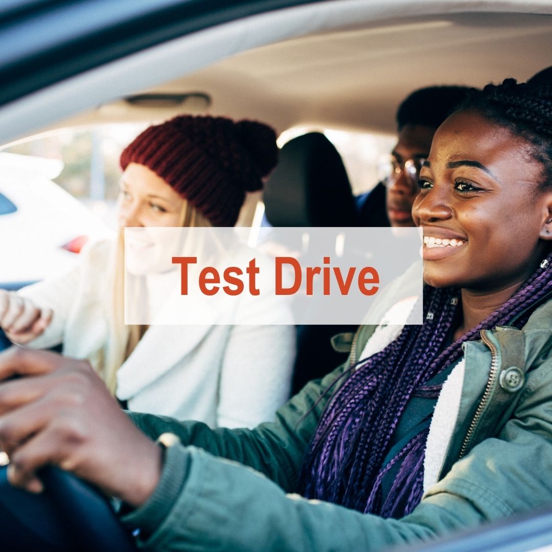 younger people driving in car | Test Drive
