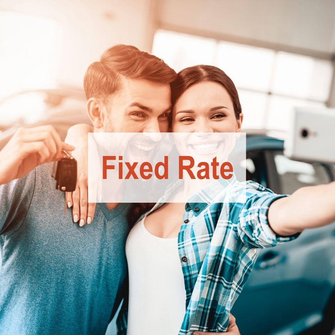A couple taking a selfie at car dealership | Fixed Rates