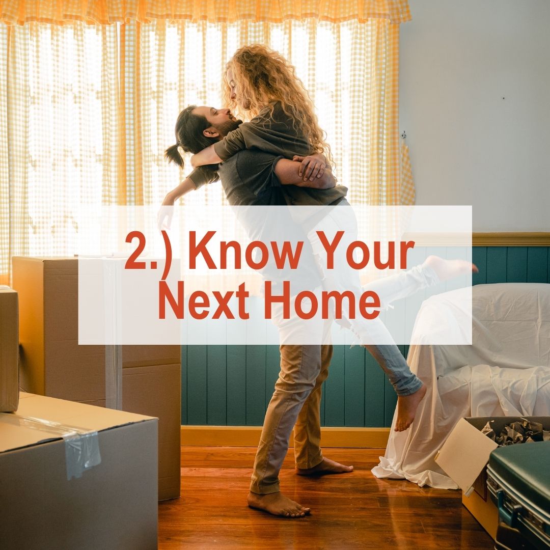 a man holding a woman up in room with boxes | Know Your Next Home