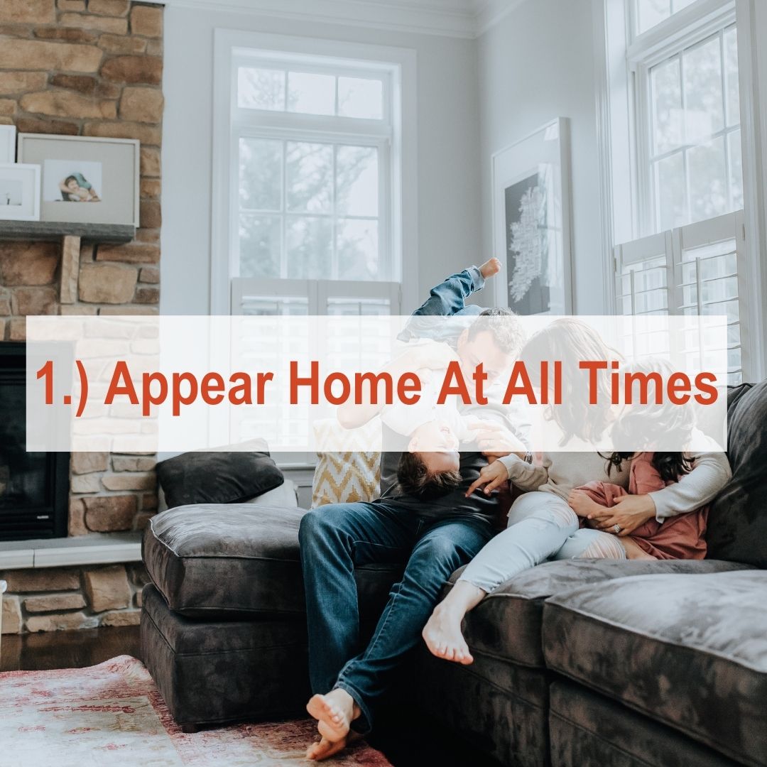 family laughing on couch | Appear Home At All Times