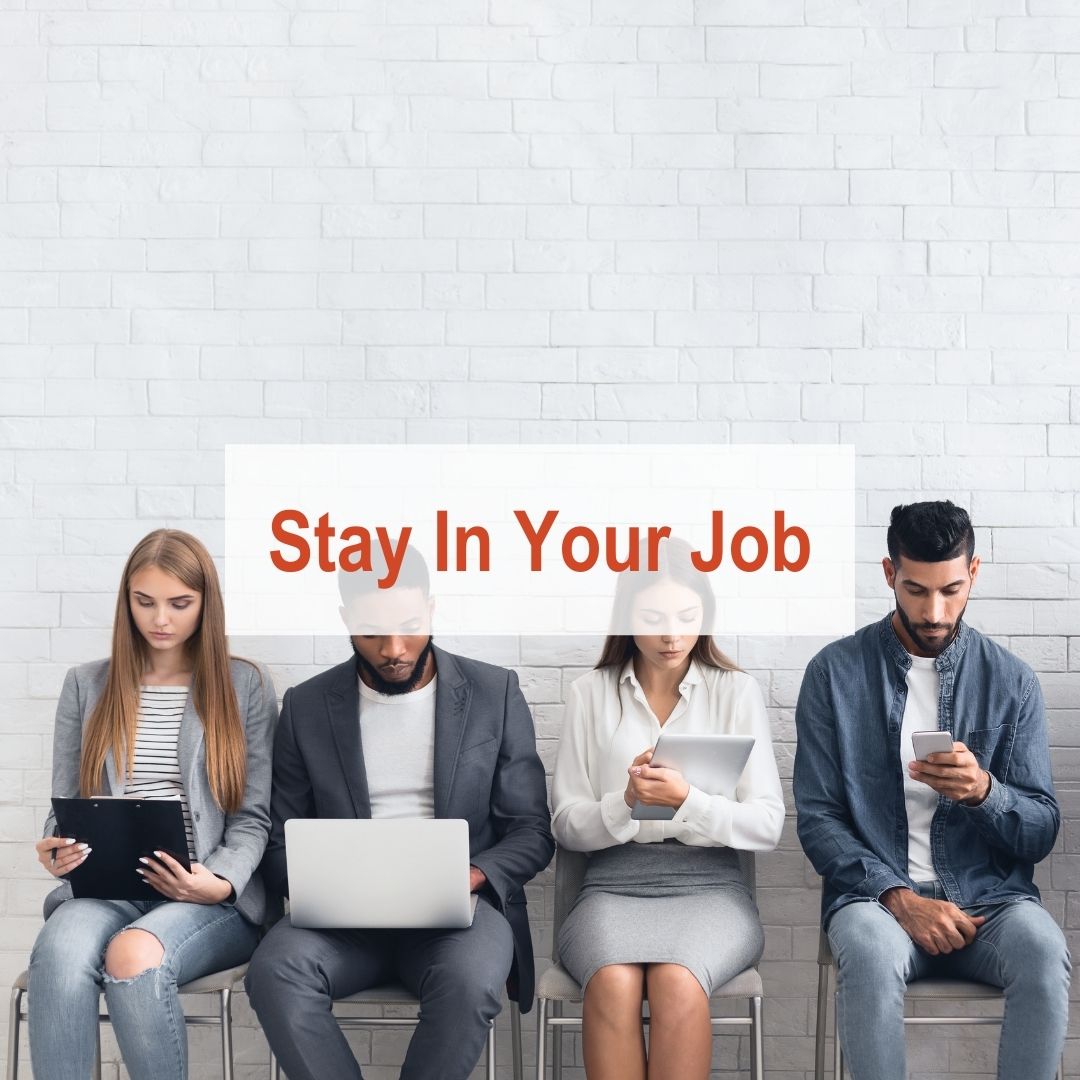 4 people sitting in chairs | Stay In Your Job