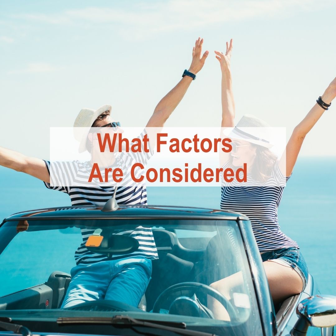 two people sitting in convertible with hands up | What Factors Are Considered