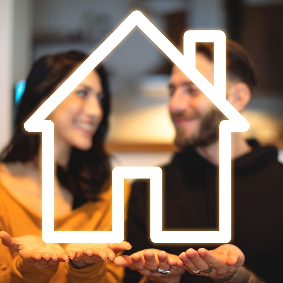 a man and woman holding hands out with neon house outline in their hands