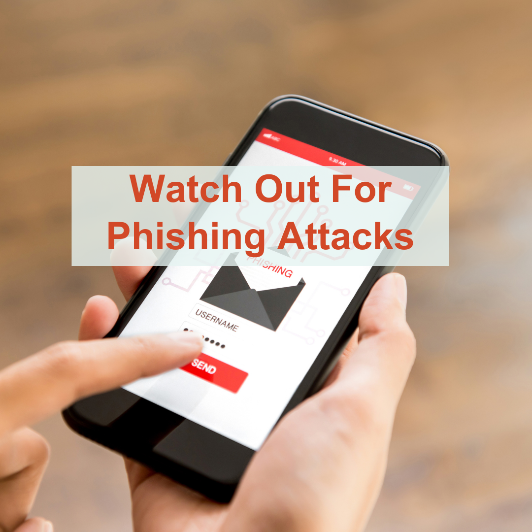 Hands Holding iPhone with Phishing email on the screen- 'Watch Out For Phishing Attacks'